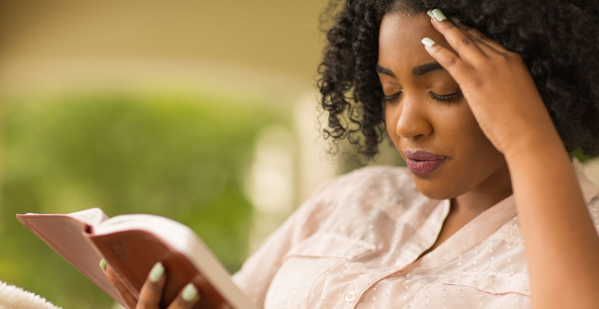 woman finding peace through prayer and reading the bible