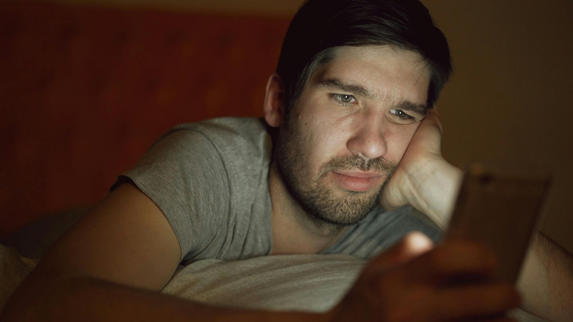 man not liking what he's seeing on phone