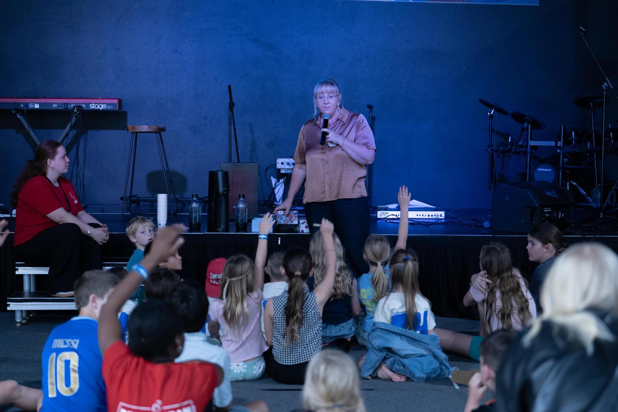pastor speaking to kids at kids church